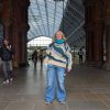Woman standing in St Pancras train station entrance in London England.